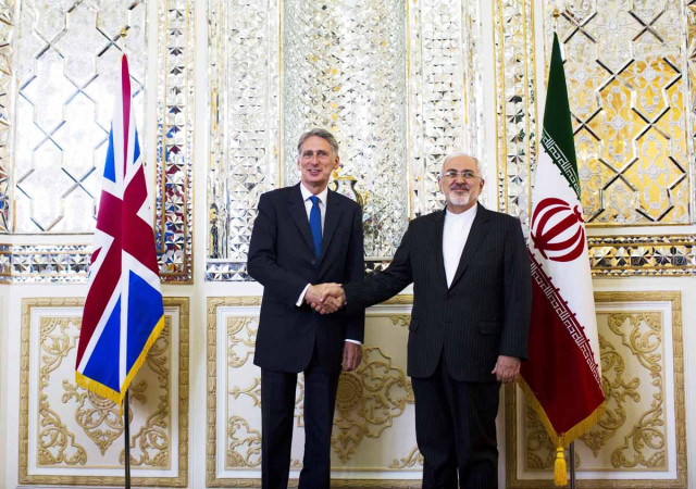 british foreign secretary philip hammond shakes hands with iranian foreign minister javad zarif in tehran after reopening the uk embassy photo afp british foreign secretary philip hammond shakes hands with iranian foreign minister javad zarif in tehran after reopening the uk embassy photo afp