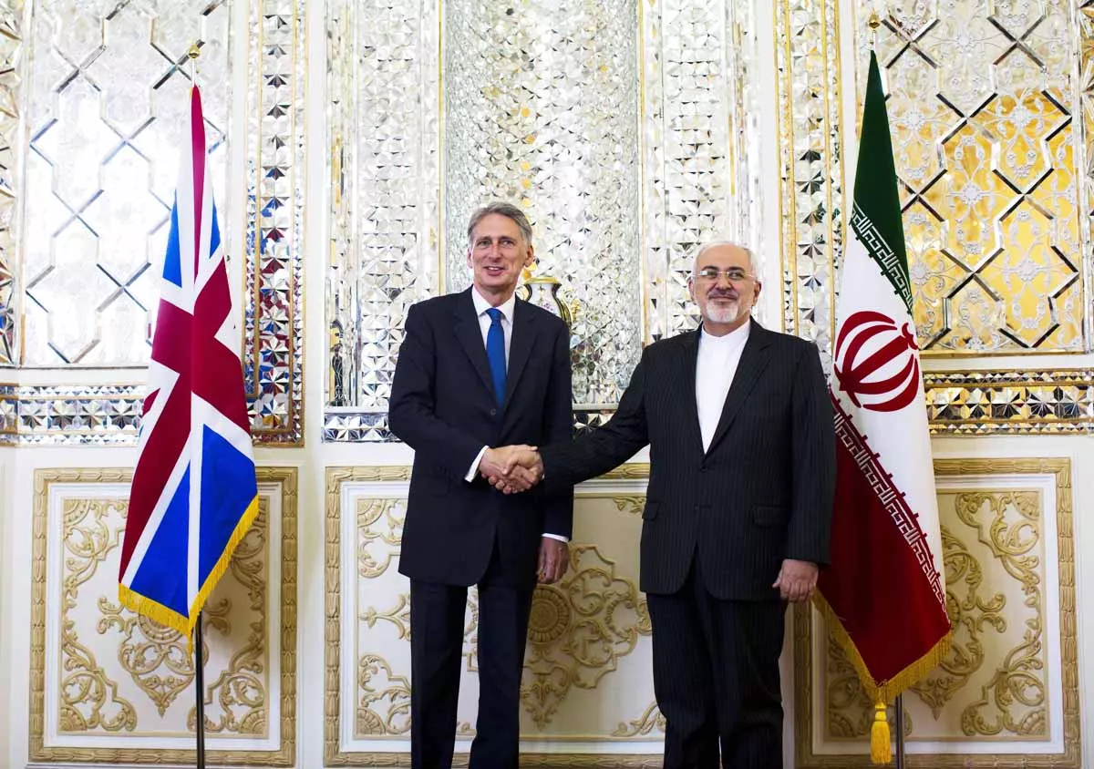 british foreign secretary philip hammond shakes hands with iranian foreign minister javad zarif in tehran after reopening the uk embassy photo afp british foreign secretary philip hammond shakes hands with iranian foreign minister javad zarif in tehran after reopening the uk embassy photo afp