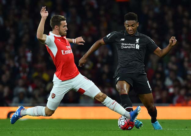 liverpool 039 s english defender joe gomez r is tackled by arsenal 039 s welsh midfielder aaron ramsey during the english premier league football match between arsenal and liverpool at the emirates stadium north london on august 24 2015 photo afp