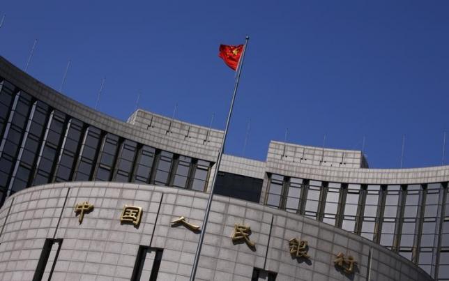 a chinese national flag flutters outside the headquarters of the people 039 s bank of china the chinese central bank in beijing april 3 2014 photo reuters