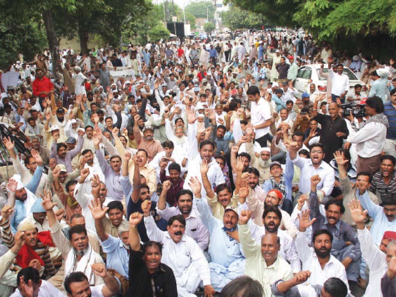 protesters chant slogans against the government over its plans to privatise power distribution companies photo abid nawaz express