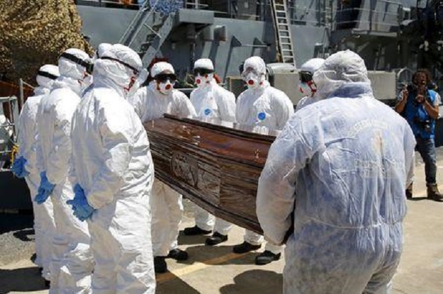 a coffin containing the body of an unidentified migrant is carried off the irish navy ship le niamh in the sicilian harbour of messina italy july 29 2015 photo reuters