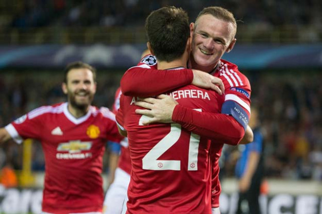 manchester 039 s wayne rooney r celebrates with his teammate ander herrera after scoring a goal during the uefa champions league playoff football match between club brugge and manchester united at jan breydel stadium in bruges on august 26 2015 photo afp manchester 039 s wayne rooney r celebrates with his teammate ander herrera after scoring a goal during the uefa champions league playoff football match between club brugge and manchester united at jan breydel stadium in bruges on august 26 2015 photo afp