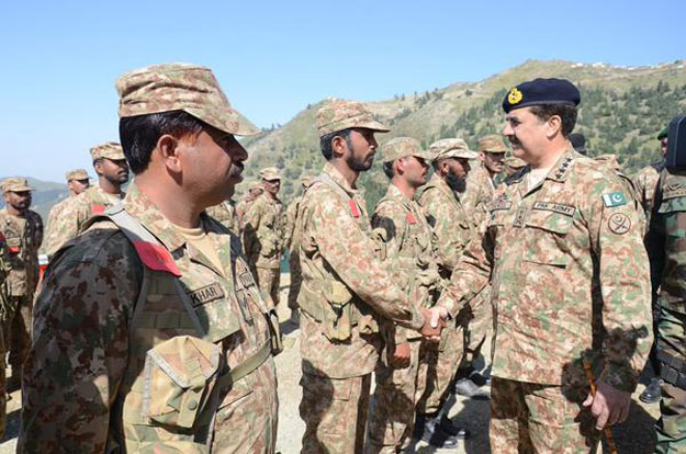 chief of army staff general raheel sharif shakes hands with troops during his visit to shawal valley on thursday photo ispr
