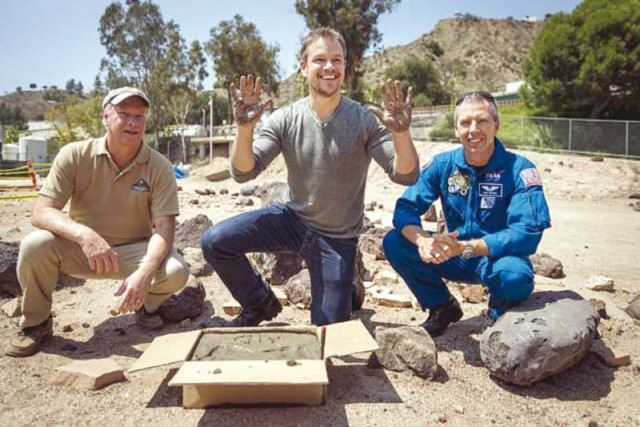 actor matt damon c who stars as nasa astronaut mark watney in the film the martian smiles after having made his hand prints in cement at the nasa lab photo file actor matt damon c who stars as nasa astronaut mark watney in the film the martian smiles after having made his hand prints in cement at the nasa lab photo file