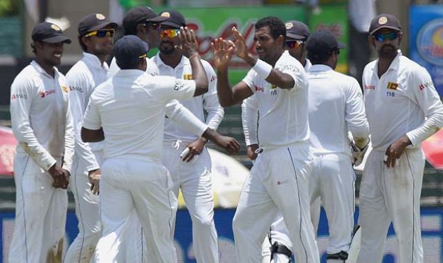 sri lankan cricketer dhammika prasad c celebrates with teammates after he dismissed indian cricketer rohit sharma during the second day of the third and final test cricket match between sri lanka and india at the sinhalese sports club ssc in colombo on august 29 2015 photo afp