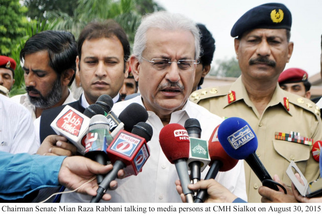senate chairman raza rabbani talks to media at the cmh sialkot on august 30 2015 photo pid