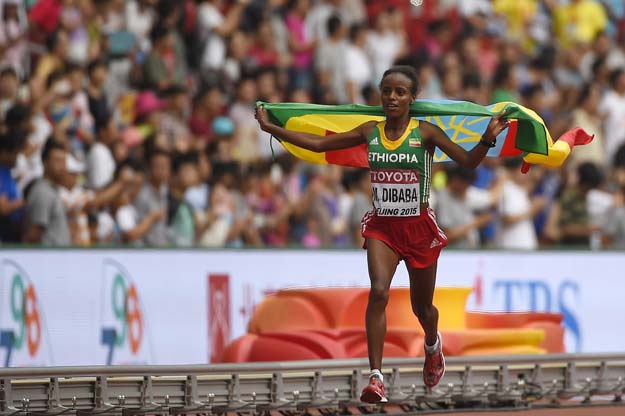 ethiopia 039 s mare dibaba celebrates after winning the final of the women 039 s marathon athletics event at the 2015 iaaf world championships at the quot bird 039 s nest quot national stadium in beijing on august 30 2015 photo afp