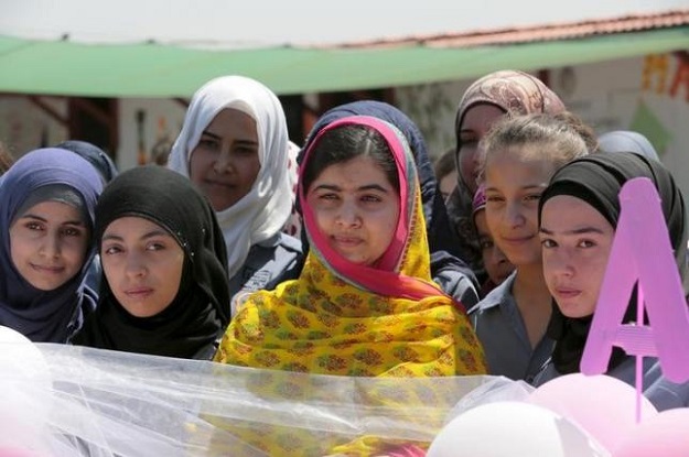 nobel peace prize laureate malala yousafzai c poses with girls for a picture at a school for syrian refugee girls built by the ngo kayany foundation in lebanon 039 s bekaa valley july 12 2015 photo reuters