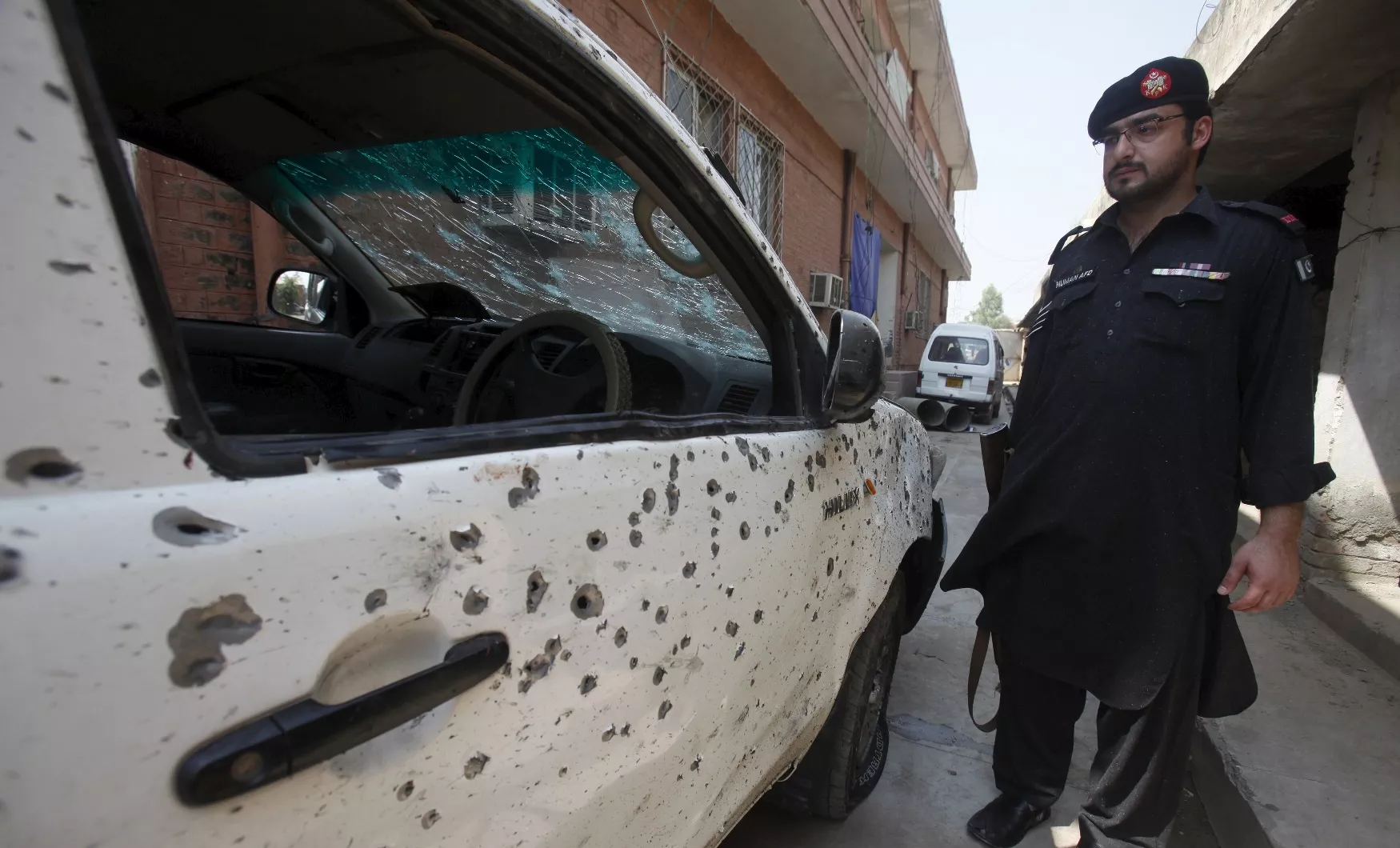 a security official stands next to a vehicle damaged in a suicide attack in jamrud pakistan september 1 2015 photo reuters a security official stands next to a vehicle damaged in a suicide attack in jamrud pakistan september 1 2015 photo reuters