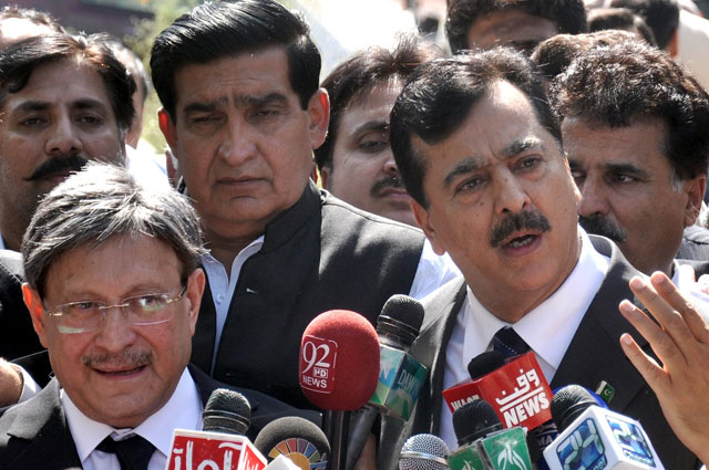 former prime minister yousuf raza gilani talking to media outside islamabad high court after being granted a pre arrest protective bail in tdap corruption case on september 1 photo inp
