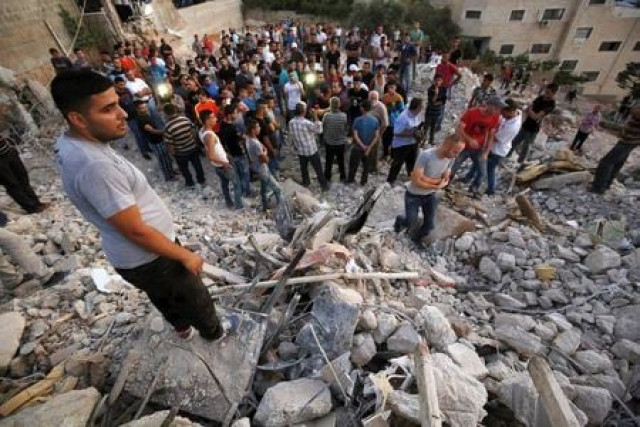 palestinians stand next to the rubble of a house which was destroyed by israeli troops during an israeli raid in the west bank city of jenin september 1 2015 photo reuters palestinians stand next to the rubble of a house which was destroyed by israeli troops during an israeli raid in the west bank city of jenin september 1 2015 photo reuters