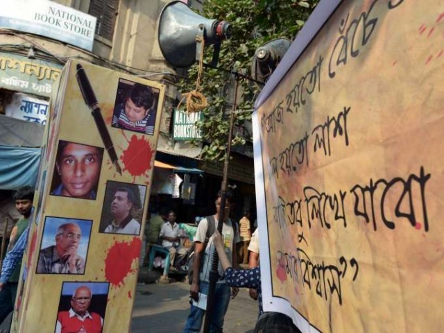 a poster with pictures of slain bangladeshi bloggers during a protest meeting organised to pay homage on may 16 2015 photo afp