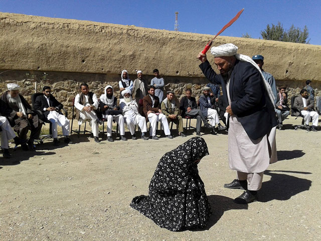 an afghan judge hits a woman with a whip in front of a crowd in ghor province afghanistan august 31 2015 photo reuters