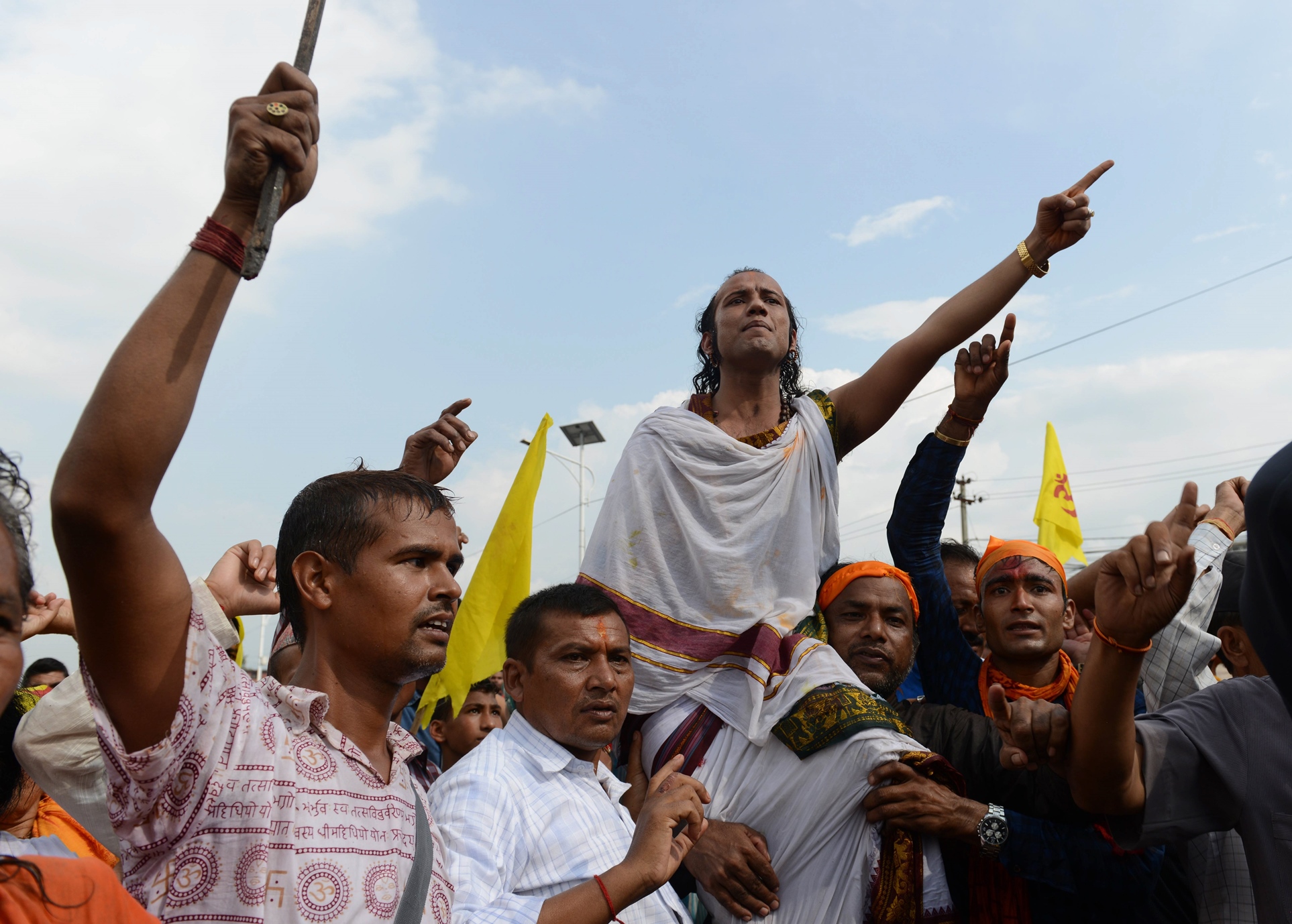 nepalese activist chants slogans during a protest demanding nepal be declared a hindu state in kathmandu on september 1 2015 photo afp