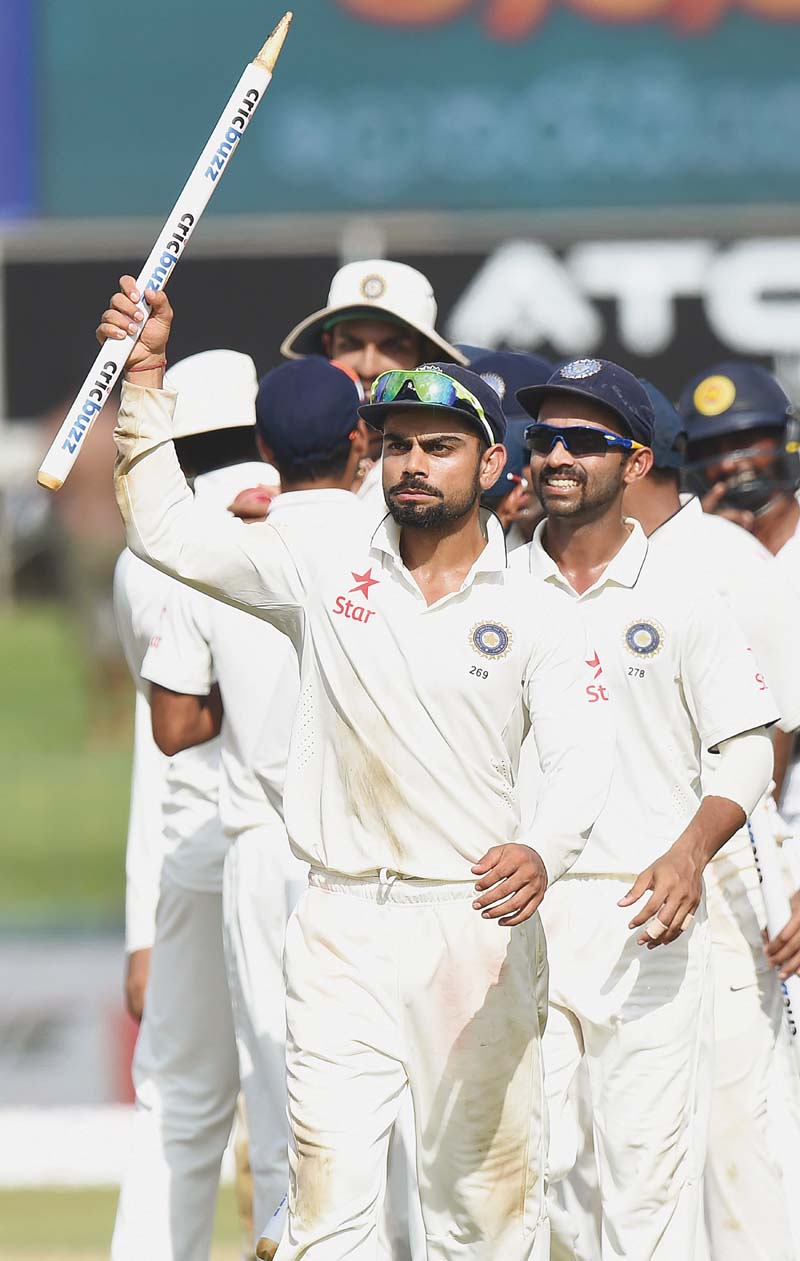 kohli walks off with a stump after claiming a historic win in his first full series since being appointed test captain photo afp