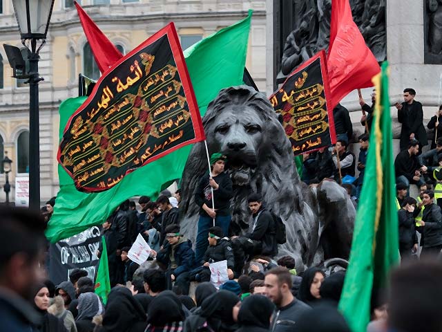 muslims gather with flags in trafalgar square following the annual ashura march photo getty