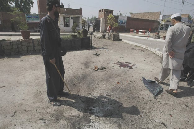 security officers inspecting the bomb site outside the apa 039 s office photo online