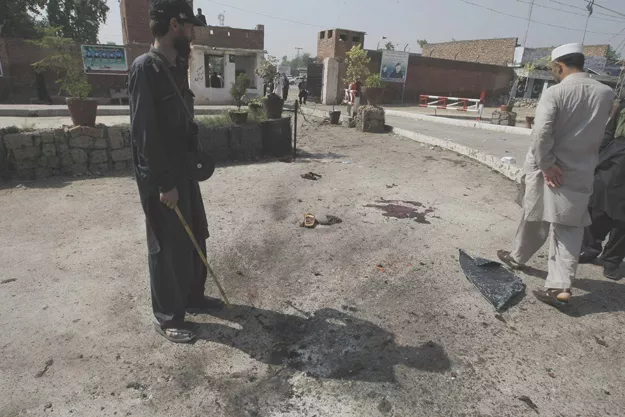 security officers inspecting the bomb site outside the apa 039 s office photo online security officers inspecting the bomb site outside the apa 039 s office photo online