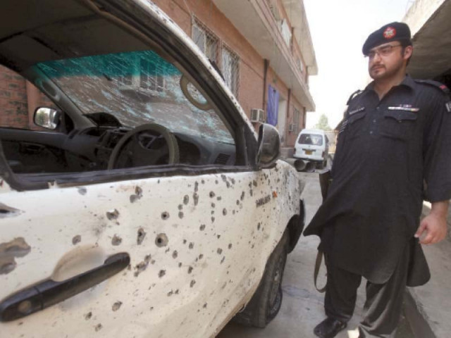 a security official stands next to a vehicle damaged in the jamrud suicide attack photo reuters a security official stands next to a vehicle damaged in the jamrud suicide attack photo reuters