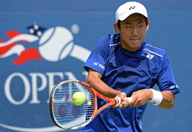 yoshihito nishioka of japan hits a return to paul henri mathieu of france during their us open 2015 first round men 039 s singles match at the usta billie jean king national center september 1 2015 in new york photo afp