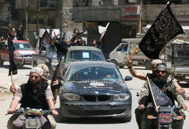 fighters from al qaeda 039 s syrian affiliate al nusra front drive in the northern syrian city of aleppo on may 26 2015