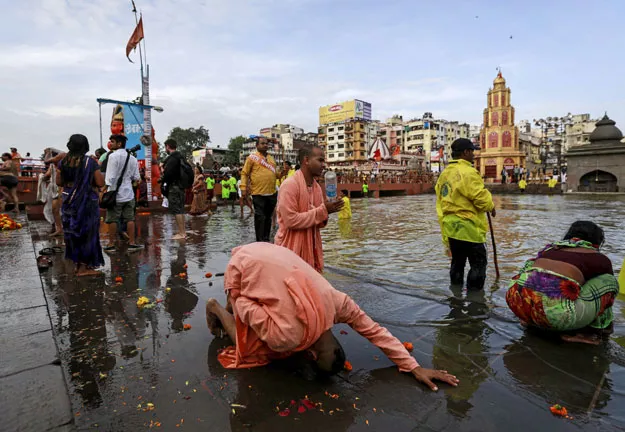 sadhus or hindu holy men pray along the godavari river during the first quot shahi snan quot grand bath at quot kumbh mela quot or pitcher festival in nashik india august 29 2015 hundreds of thousands of hindus took part in the religious gathering at the banks of the godavari river in nashik city at the festival which is held every 12 years in different indian cities photo reuters sadhus or hindu holy men pray along the godavari river during the first quot shahi snan quot grand bath at quot kumbh mela quot or pitcher festival in nashik india august 29 2015 hundreds of thousands of hindus took part in the religious gathering at the banks of the godavari river in nashik city at the festival which is held every 12 years in different indian cities photo reuters