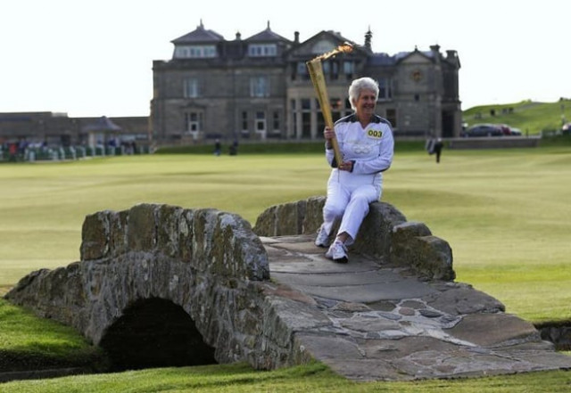 torch bearer louise martin poses for photographers with the london 2012 olympic torch on the swilken bridge next to the eighteenth tee on the old course at st andrews in scotland june 13 2012 photo reuters torch bearer louise martin poses for photographers with the london 2012 olympic torch on the swilken bridge next to the eighteenth tee on the old course at st andrews in scotland june 13 2012 photo reuters