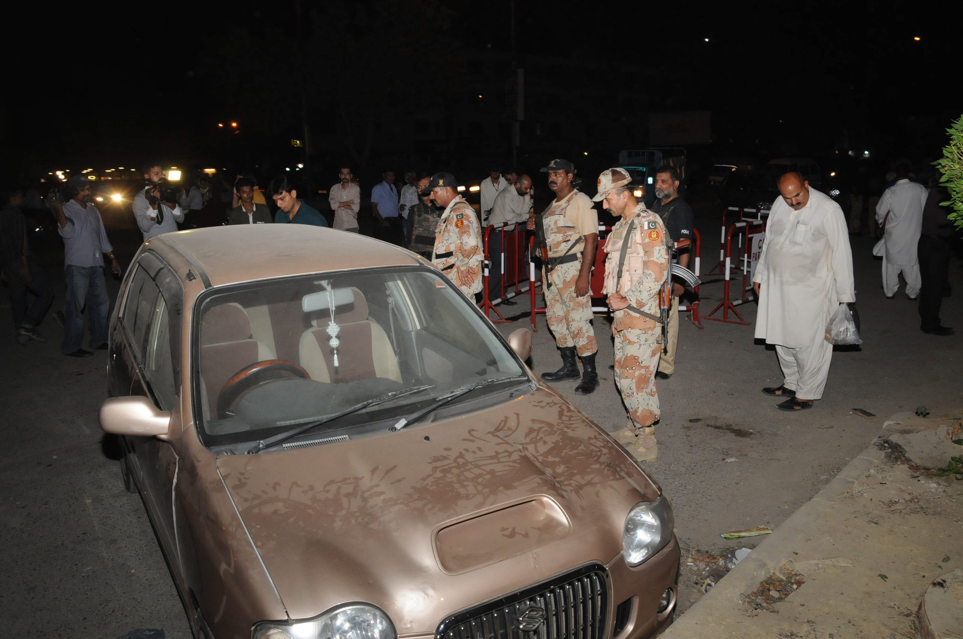 rangers inspect the blast site after the killing of two traffic wardens at university road in karachi on august 30 2015 photo mohammad noman express