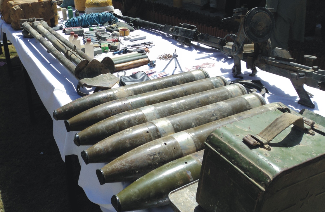 officials display weapons ammunition and explosives recovered during raids in balochistan photo banaras khan express