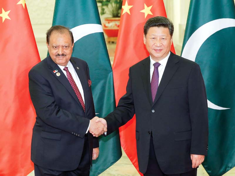 president mamnoon shakes hands with xi jinping before their meeting photo afp