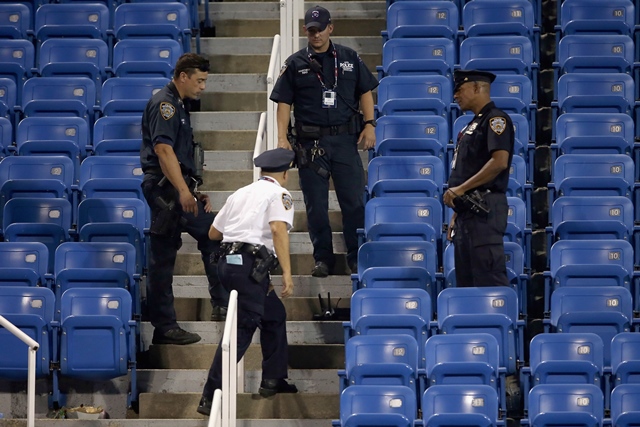 police stand guard next to a drone after it crashed into the stands in louis armstrong stadium during the during their women 039 s singles second round match photo afp