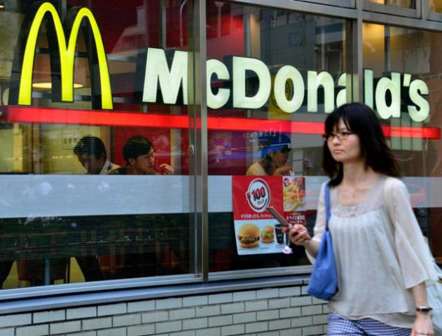 a pedestrian walks past a mcdonald 039 s restaurant in tokyo on july 23 2014 photo afp a pedestrian walks past a mcdonald 039 s restaurant in tokyo on july 23 2014 photo afp