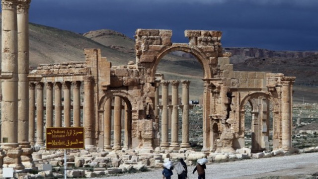 syrians walking in the ancient oasis city of palmyra on march 14 2014 photo afp syrians walking in the ancient oasis city of palmyra on march 14 2014 photo afp