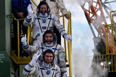 three man international crew safely reaches space station