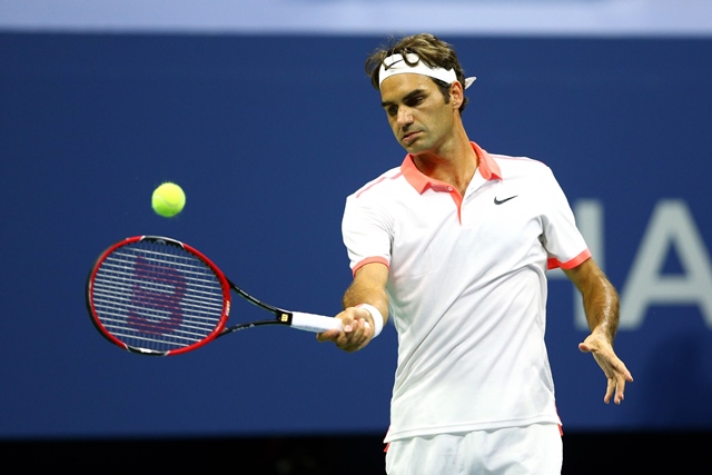 roger federer of switzerland returns a shot to steve darcis of belgium during their men 039 s singles second round match on day four of the 2015 us open photo afp