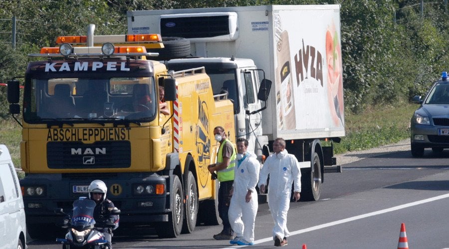 a truck in which up to 50 migrants were found dead is prepared to be towed away on a motorway near parndorf austria august 27 2015 photo reuters