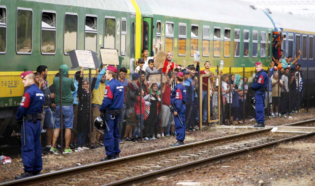 migrants stage a protest in front of a train at bicske railway station hungary september 4 2015 photo reuters migrants stage a protest in front of a train at bicske railway station hungary september 4 2015 photo reuters