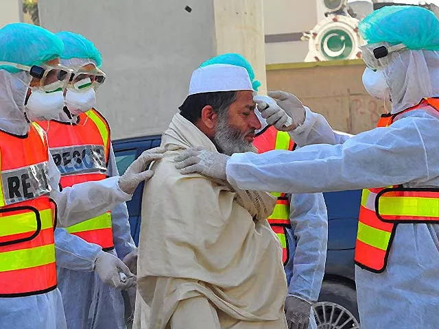 pakistani rescue personnel check the body temperature of a man during a drill as a precaution against coronavirus photo getty pakistani rescue personnel check the body temperature of a man during a drill as a precaution against coronavirus photo getty