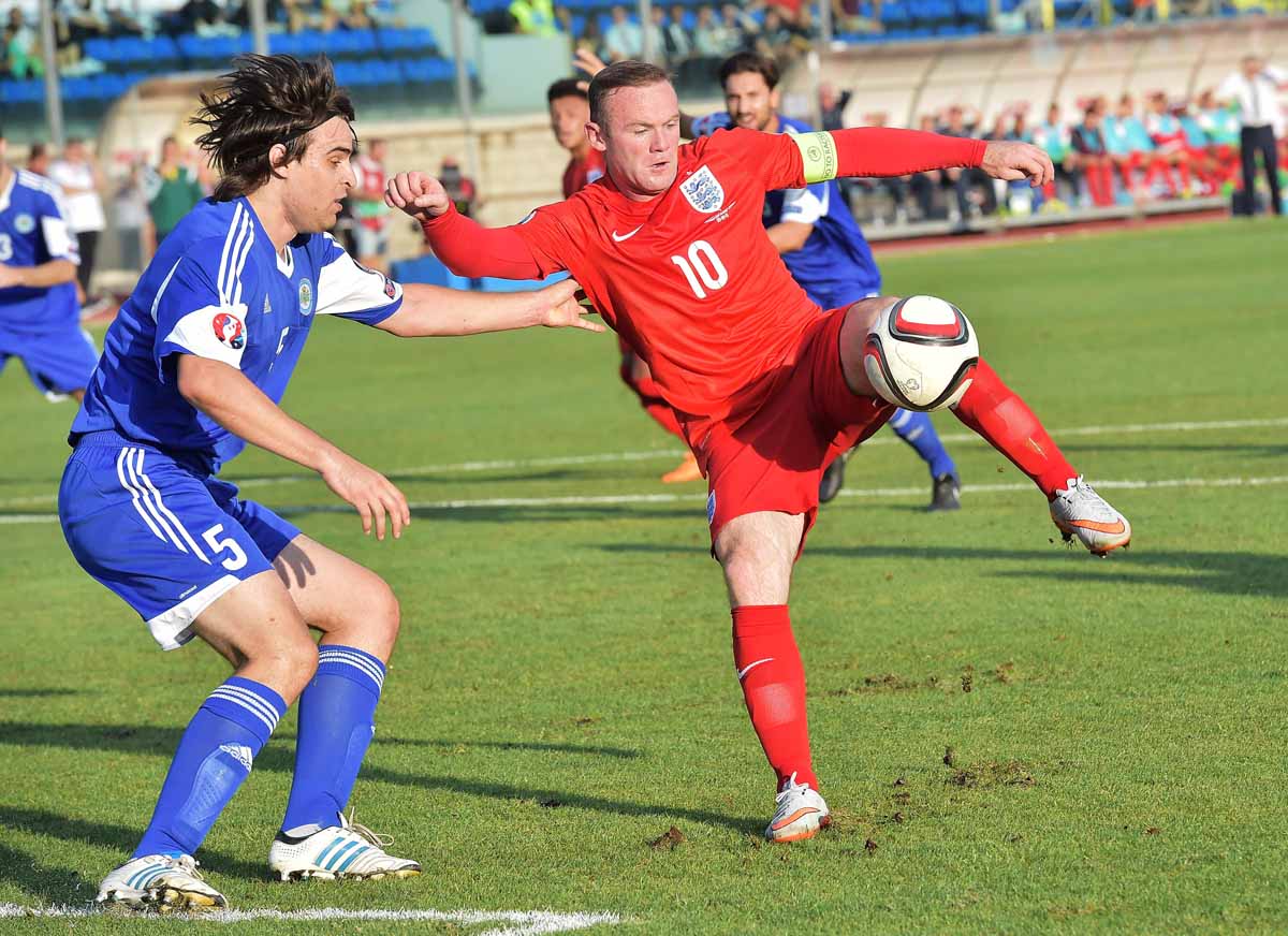 england 039 s forward wayne rooney r controls the ball over san marino 039 s defender davide simoncini during the euro 2016 qualifying football match san marino vs england at the san marino stadium in serravalle on september 5 2015 photo afp