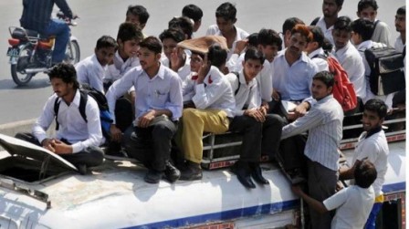 students sit on top an overloaded bus as they ride home from school photo afp