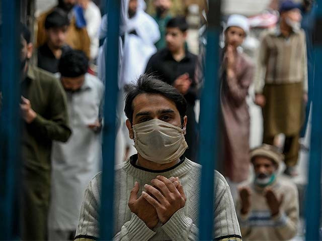 a muslim worshipper wearing a face mask prays during friday prayers photo getty a muslim worshipper wearing a face mask prays during friday prayers photo getty