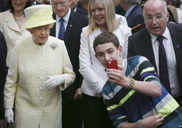 a local youth takes a selfie photograph in front of queen elizabeth ii during a visit to st george 039 s indoor market on in belfast tuesday june 24 2014 photo ap a local youth takes a selfie photograph in front of queen elizabeth ii during a visit to st george 039 s indoor market on in belfast tuesday june 24 2014 photo ap