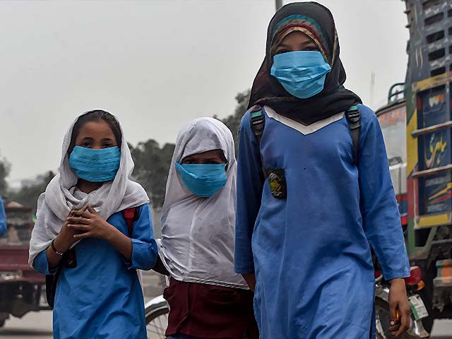 students wear face masks on their way to school photo getty students wear face masks on their way to school photo getty