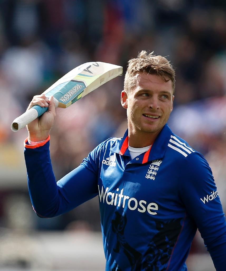 england 039 s jos buttler raises his bat after scoring 129 from 77 balls against new zealand during the first one day international at edgbaston in birmingham on june 9 2015 photo afp