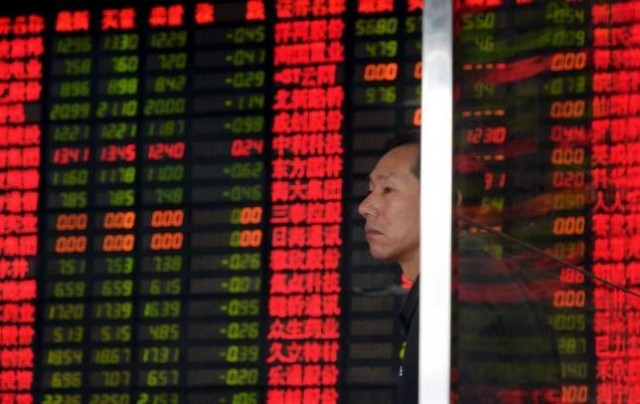 an investor stands in front of an electronic board showing stock information at a brokerage house in shanghai china september 2 2015 photo reuters an investor stands in front of an electronic board showing stock information at a brokerage house in shanghai china september 2 2015 photo reuters