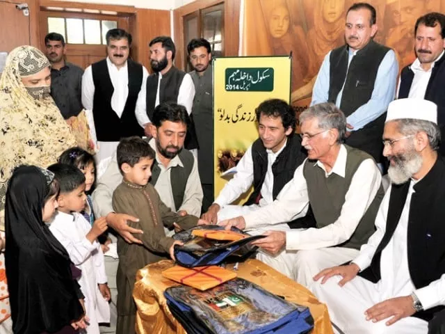 cm khattak distributing books among freshly enrolled students photo courtesy k p directorate of information cm khattak distributing books among freshly enrolled students photo courtesy k p directorate of information