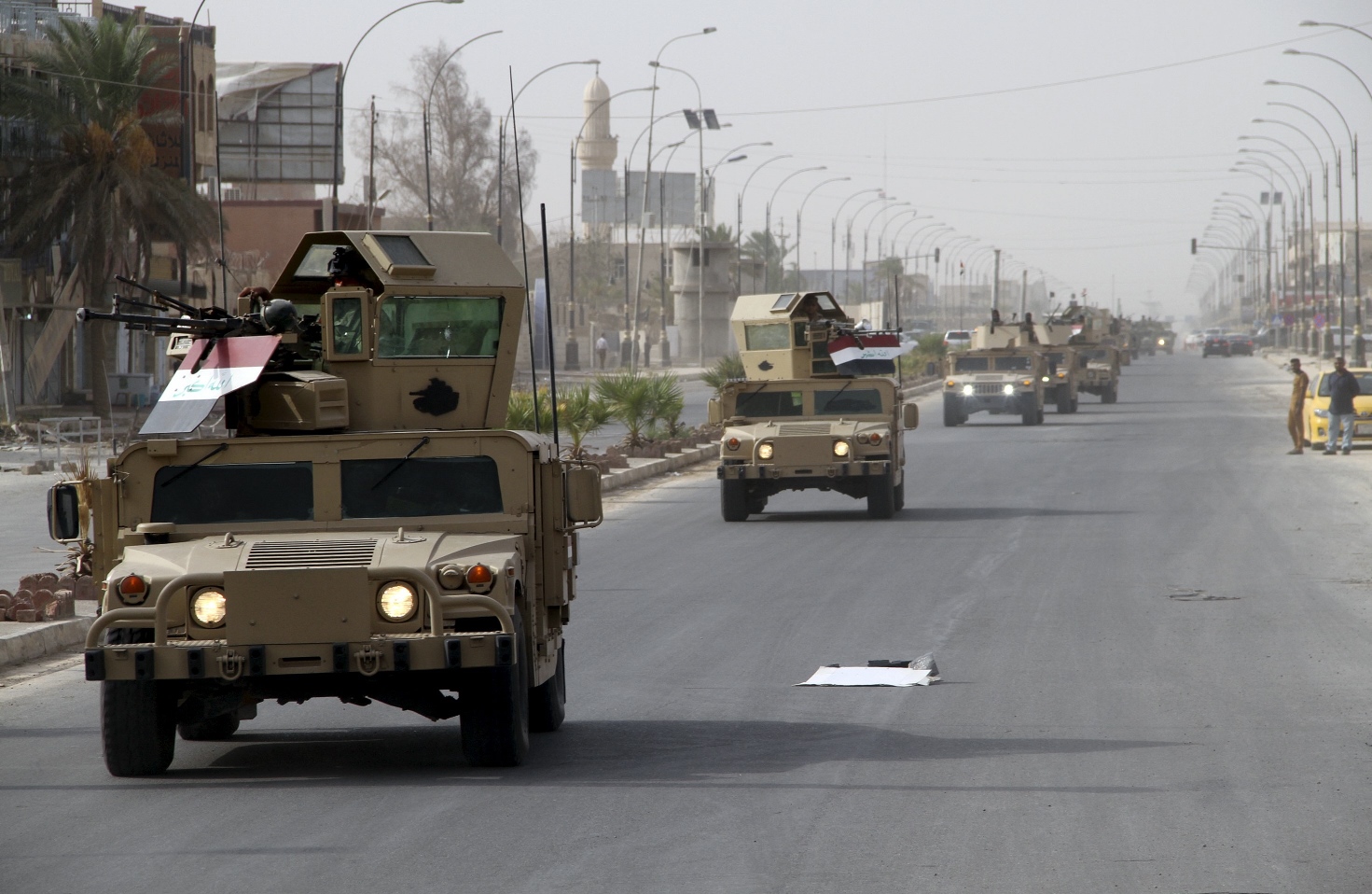 a convoy of iraqi defense forces arrives near the town of baiji september 7 2015 photo reuters