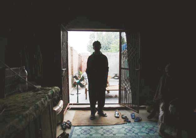 a victim of a child sex abuse scandal stands in his house in hussain khan wala town in kasur district photo reuters