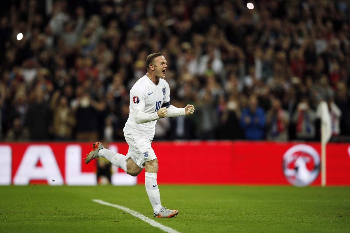 england 039 s wayne rooney celebrates after scoring a penalty against switzerland at the wembley stadium in london on tuesday photo afp